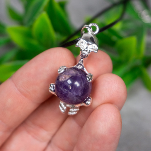Skeleton Holding Purple Fluorite Sphere Necklace
